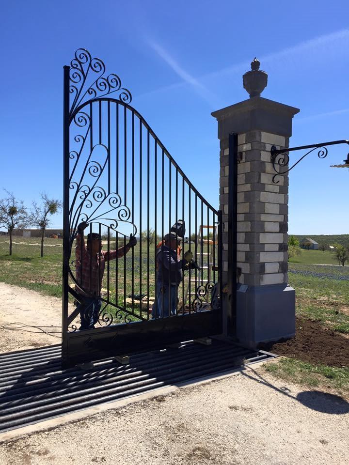 Decorative gate installation with metal posts in Abilene TX
