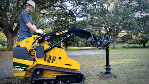 Mini skid steer auger attachment drilling holes in Abilene TX
