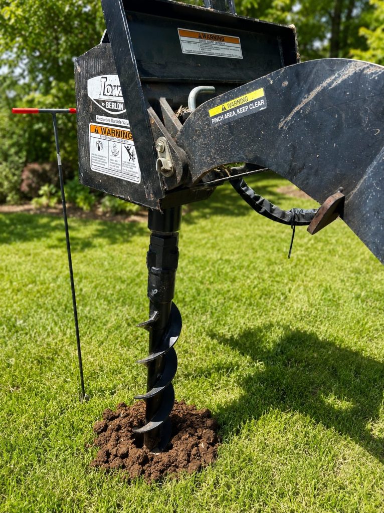 Pergola footing holes drilled in West Texas backyard