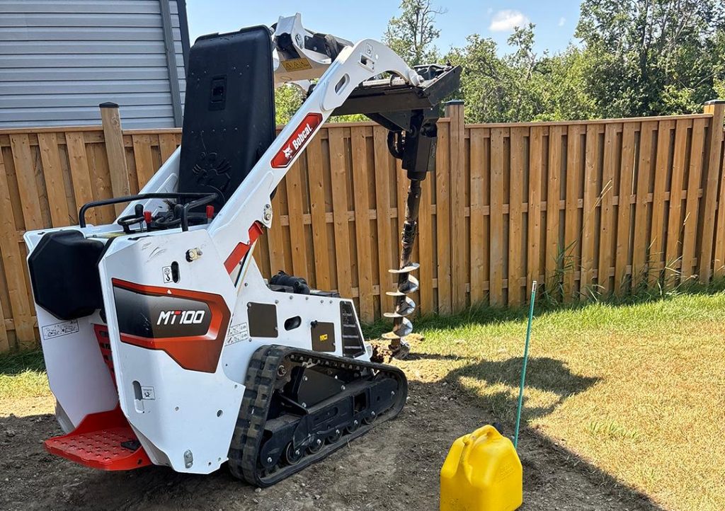 Pergola footing drilling with skid steer auger in Abilene TX