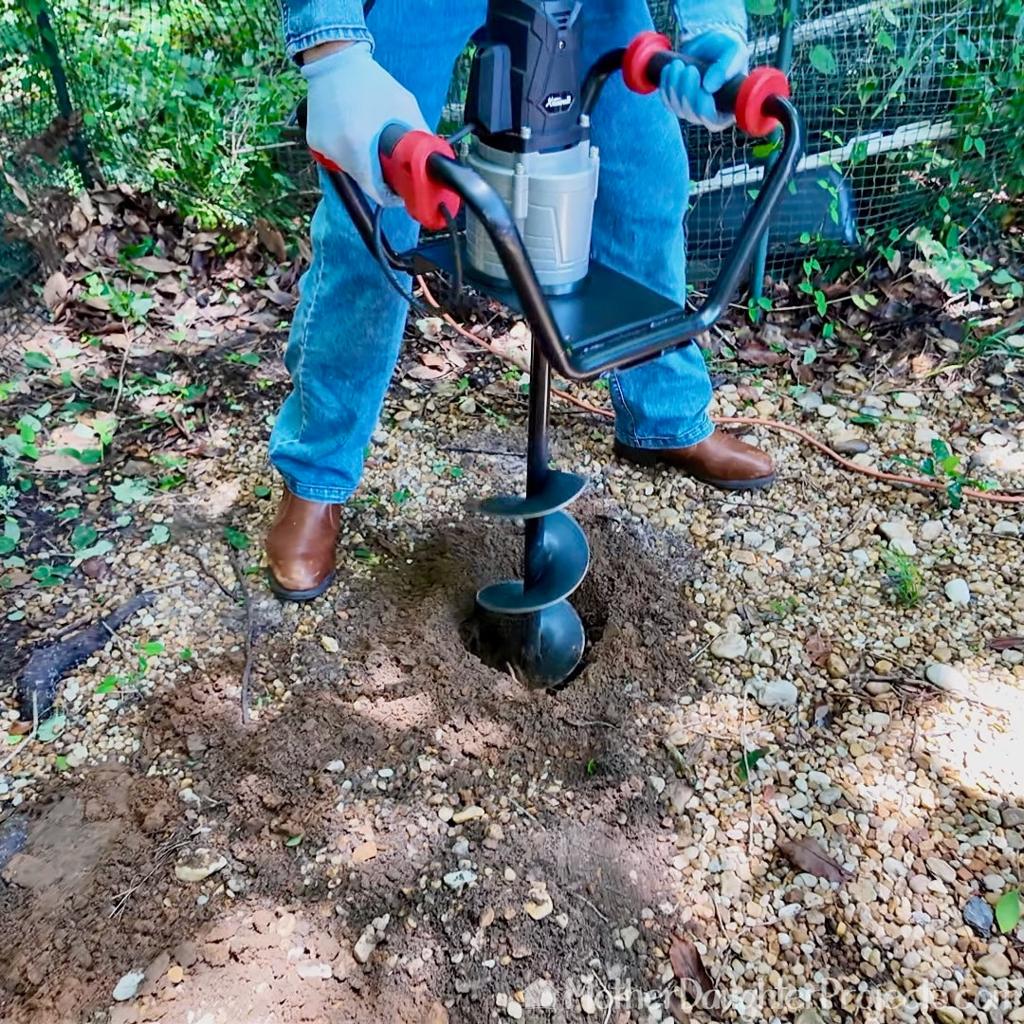 Earth auger digging ranch fence post holes in Abilene Texas