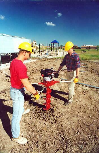 2 man earth auger drilling through rocky soil in Abilene Texas