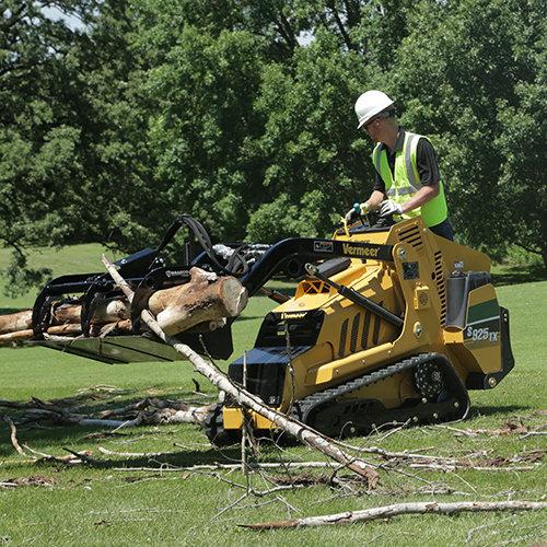 Toro Dingo mini skid steer cleaning storm debris in Abilene TX