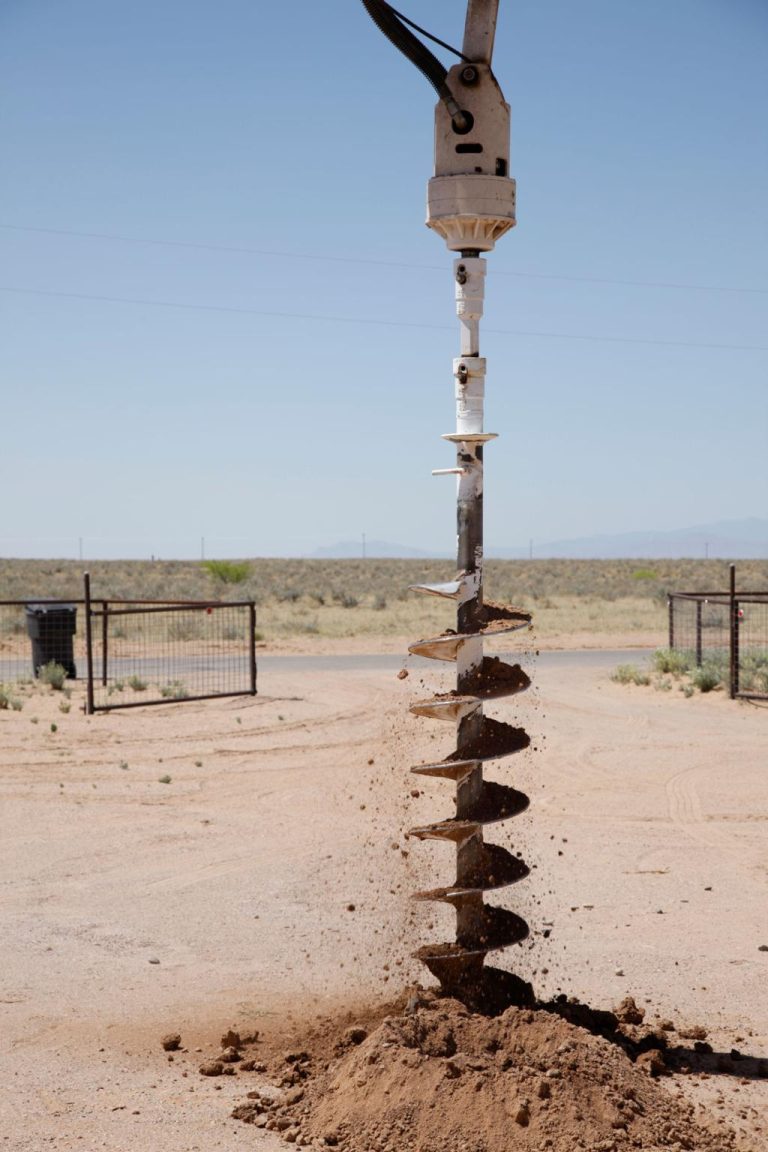 Utility pole hole drilling service with earth auger in Abilene TX