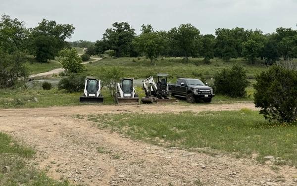 Compact Toro Dingo skid steer on ranch land in West Texas
